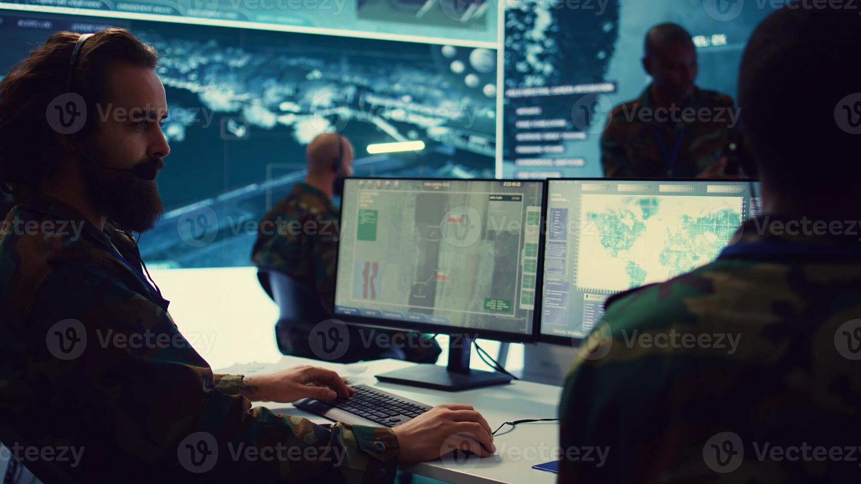 Reconnaissance department operator gathering information crucial for a national safety mission, transmitting intelligence to the troops. Telecommunications personnel in command post. Camera B. photo