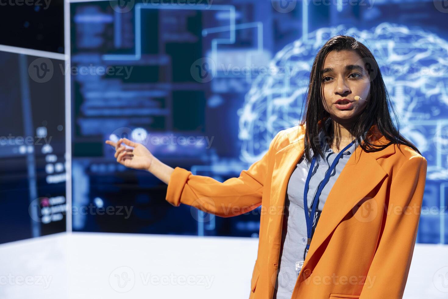 Speaker talking on stage in event bringing together leading specialists, researchers, innovators and companies from around the globe to explore latest developments in AI and machine learning photo