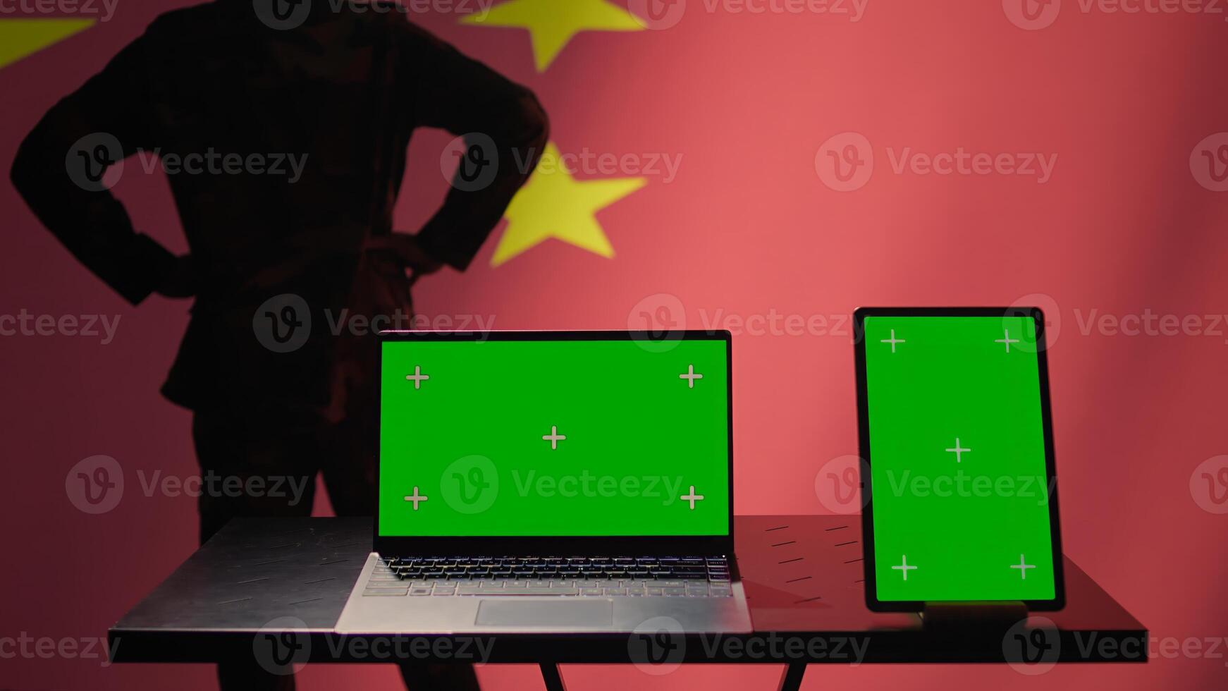 China army soldier using isolated screen laptop and tablet to identify threats from enemies. Army personnel using software on chroma key devices to relay info to war front lines, camera B photo