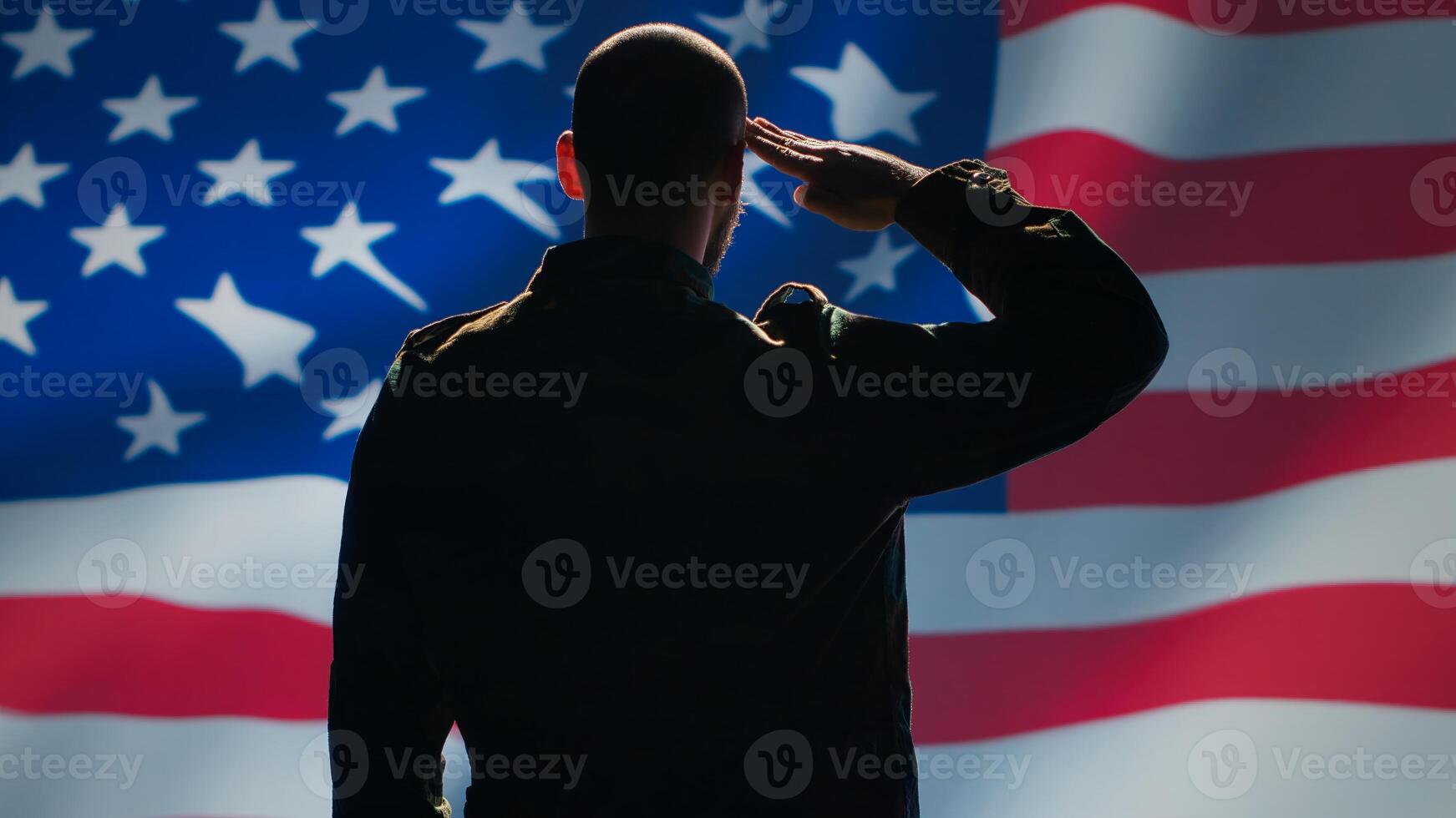 Soldier saluting USA flag, participating in 4th of July celebrations. United States of America veteran honoring country during memorial day event, doing patriotic hand gesture towards flag, camera A photo