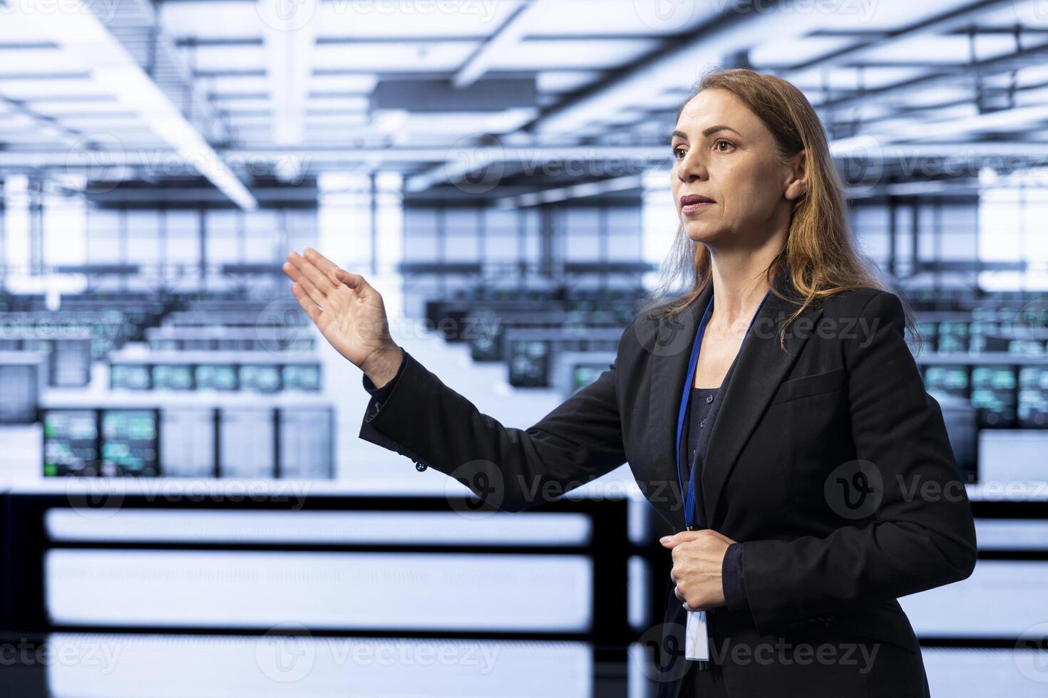 Software developer in data center checking rigs and hardware, doing checkup with AR hologram. Worker planning and executing server hub migrations and upgrades using augmented reality photo