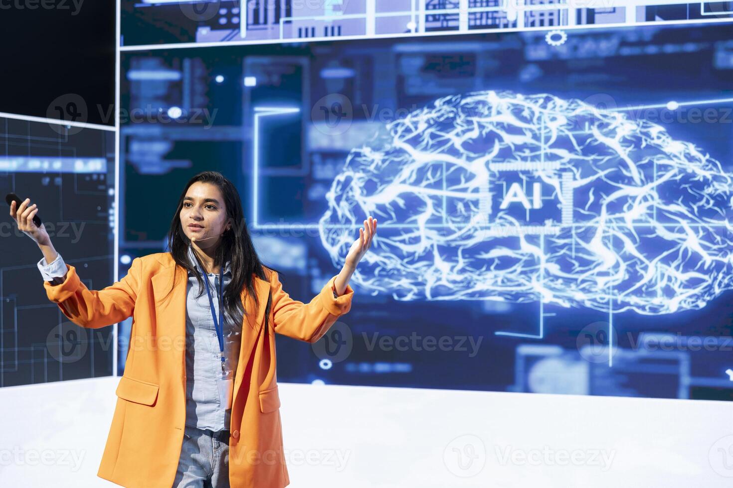 Woman speaking at tech summit, exploring latest AI technology trends and case studies. IT technician presenting latest artificial intelligence innovations during large event photo