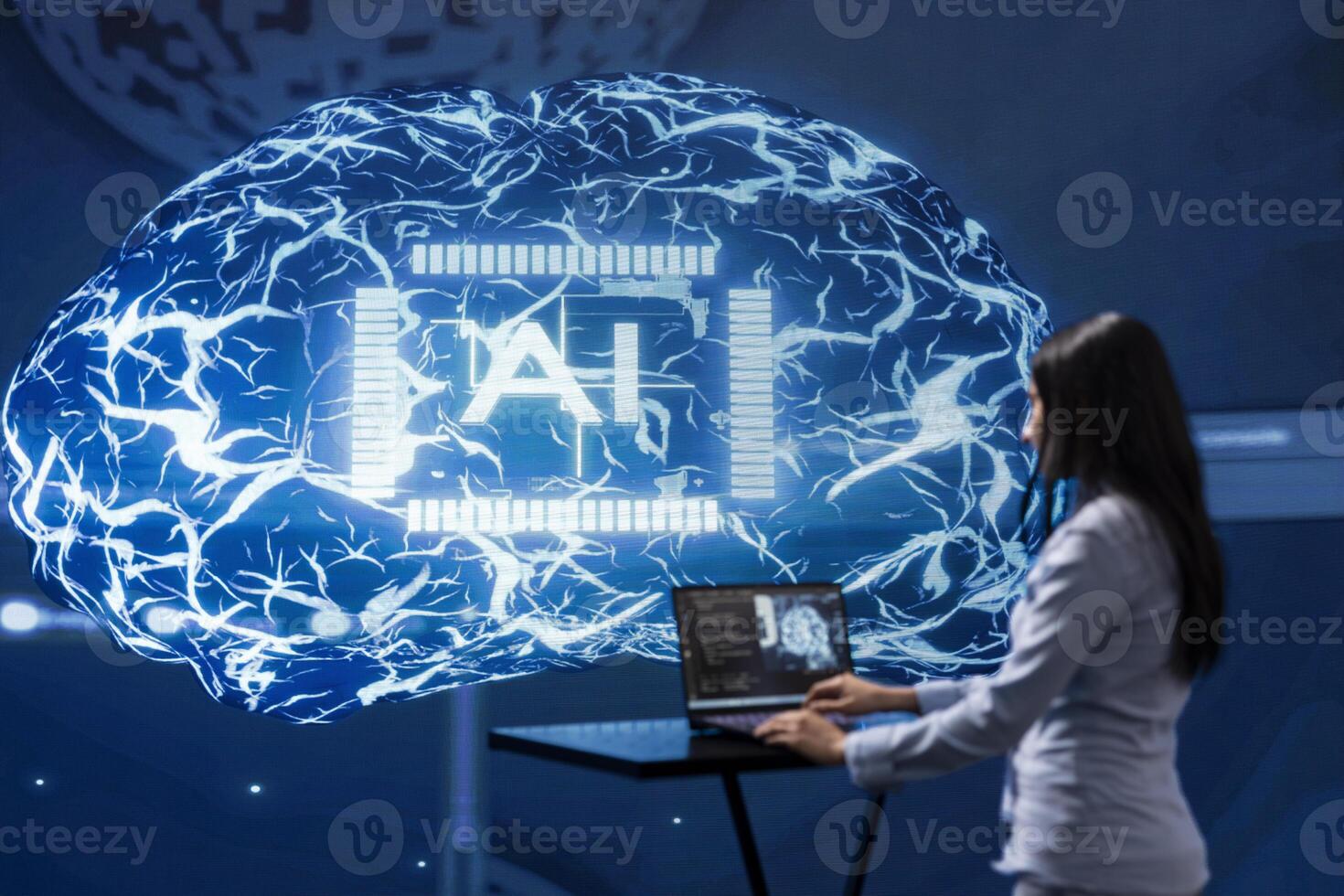 Computer scientist in startup doing advancements in AI field. Woman working on laptop in cutting edge workspace featuring artificial intelligence and neural network systems photo