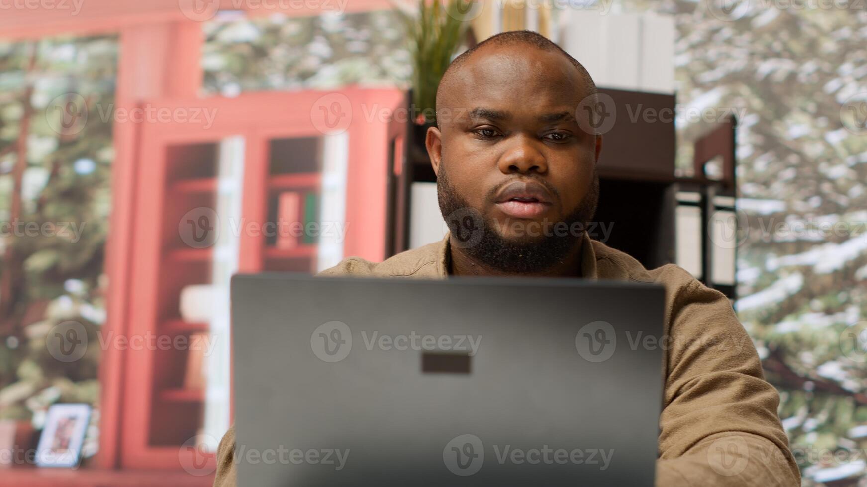 Accountancy specialist examining business funds and profit from annual sales, studying market statistics data on a laptop at home. Business owner creating a new investment plan. Camera A. photo