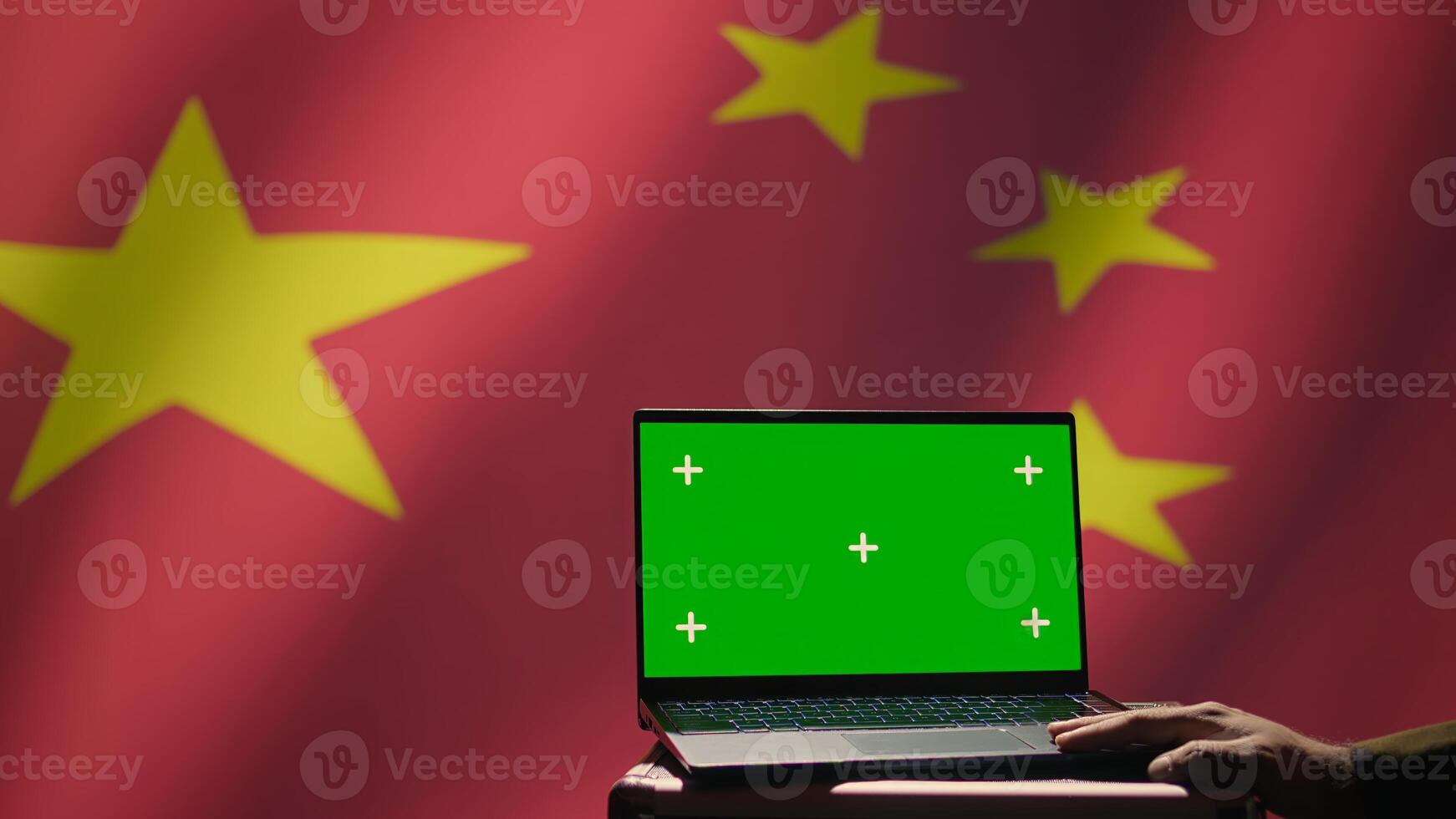 Chinese soldier using military tech on green screen laptop to identify threats from enemies. Army personnel using software on mockup notebook to communicate information to war front lines, camera B photo