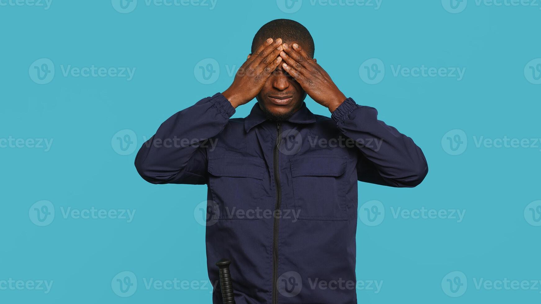 Clueless security guard shrugging shoulders, unable to answer people inquiries. Portrait of bodyguard doing lacking knowledge hand gesture, isolated over studio background, camera A photo