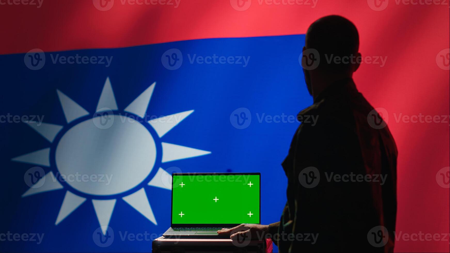 Taiwan liberation insurgent using radar on green screen laptop to detect missiles launched by China. Taiwanese army soldier scanning rockets with mockup notebook during military invasion, camera A photo