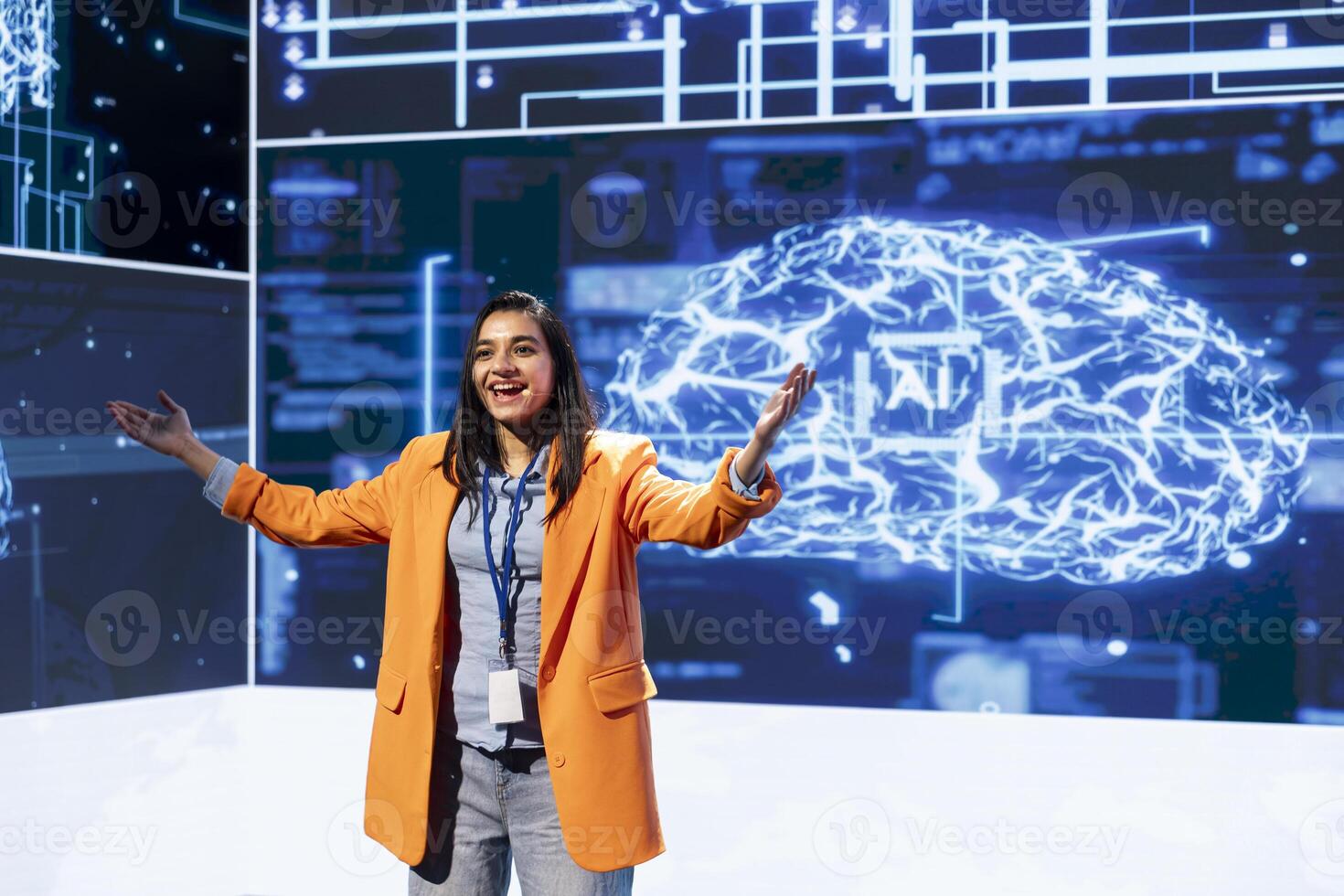 Joyous speaker doing presentation at tech conference, explore ways emerging AI technologies can positively enhance companies workforce. Cheerful presenter promoting artificial intelligence solutions photo