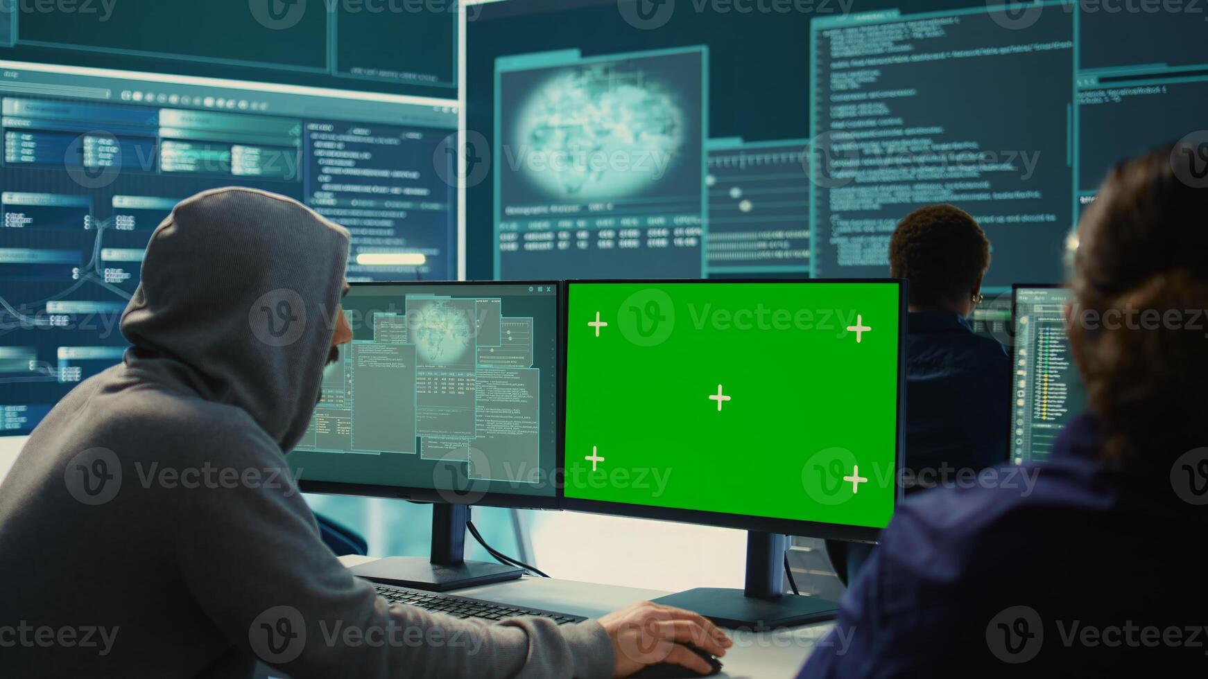 Governmental hackers working on computer with green screen to protect data and network security. Focusing on cyber defense, malware detection to prevent cyber attacks and espionage. Camera B. photo