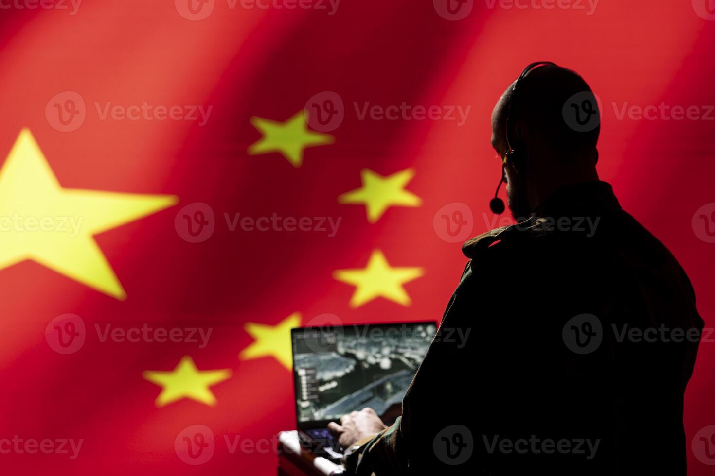 Chinese soldier using radar detecting ballistic missile attacks and conducting general space surveillance and satellite tracking. CCP agent using military laptop software preventing rockets photo