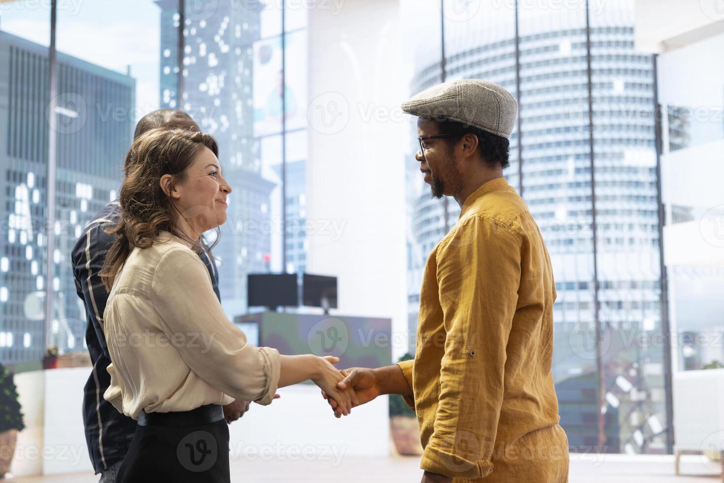 Skilled realtor salesman greeting business people for an office tour, examining new corporation workspace in an urban high class building. Development with real estate investment strategy. photo