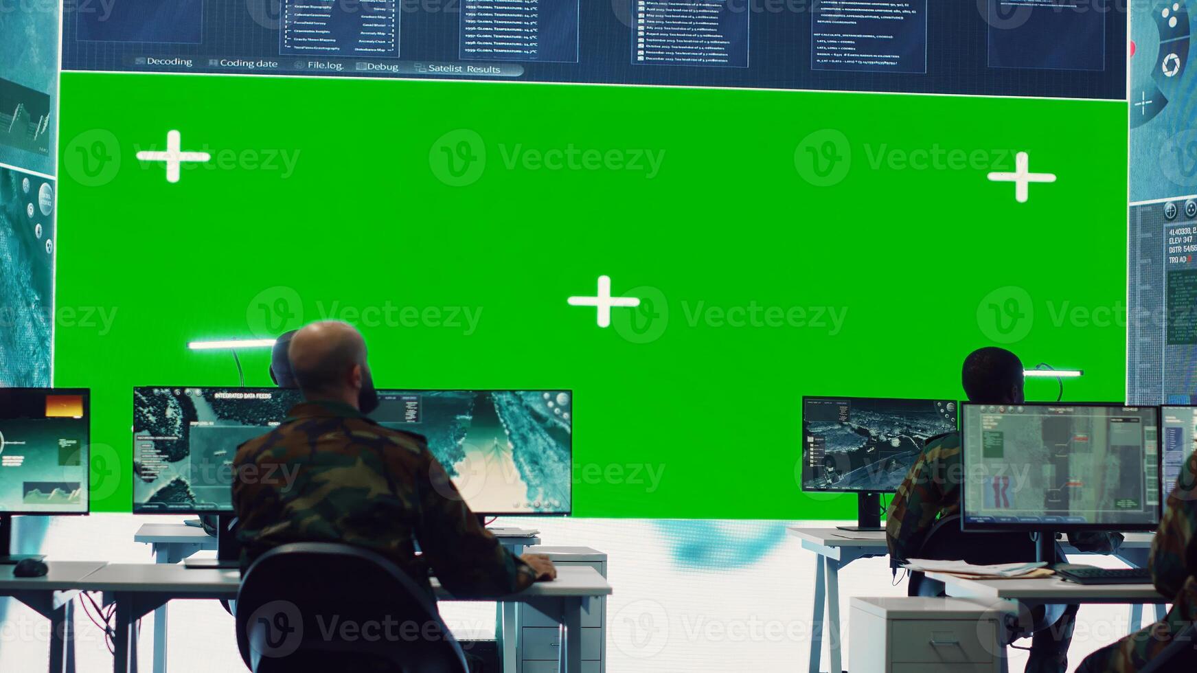 Diverse group of privates operating on a big screen isolated display, looks at a greenscreen and gathering intelligence to help with military operations in command center. Army facility base. Camera A. photo