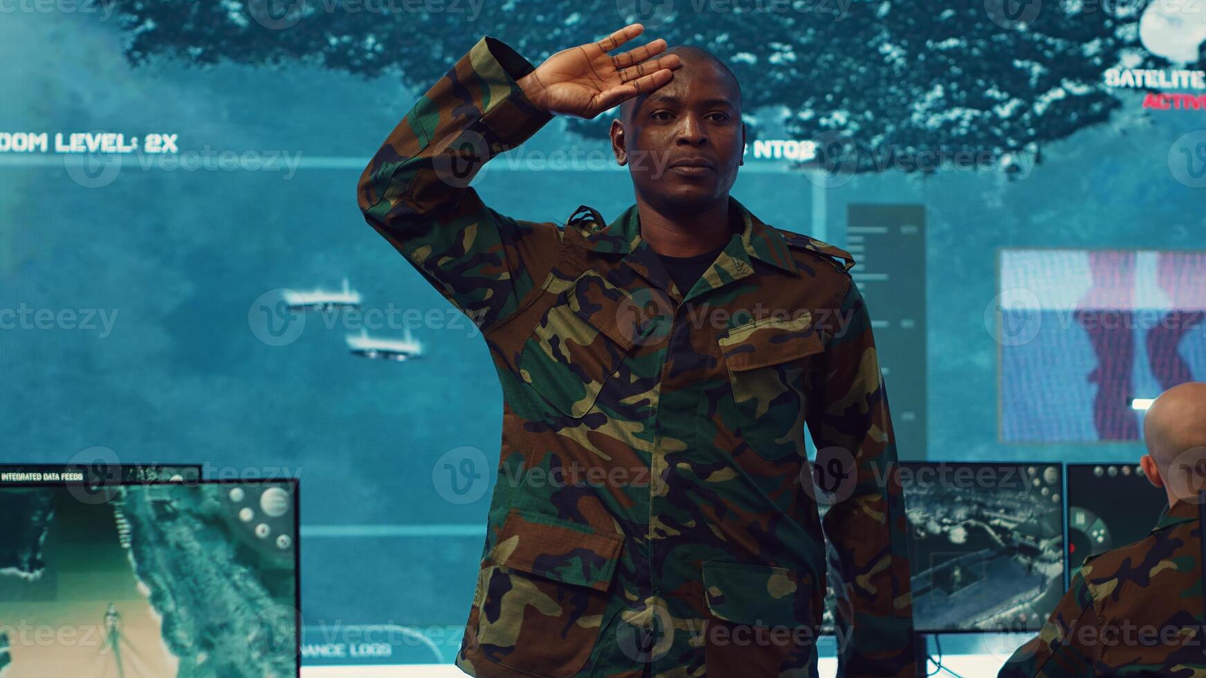 Standing at attention, the soldier executes the military salute gesture to present his respect and devotion as captain of the crew. Patriot army general saluting with right hand to his temple. Camera A. photo