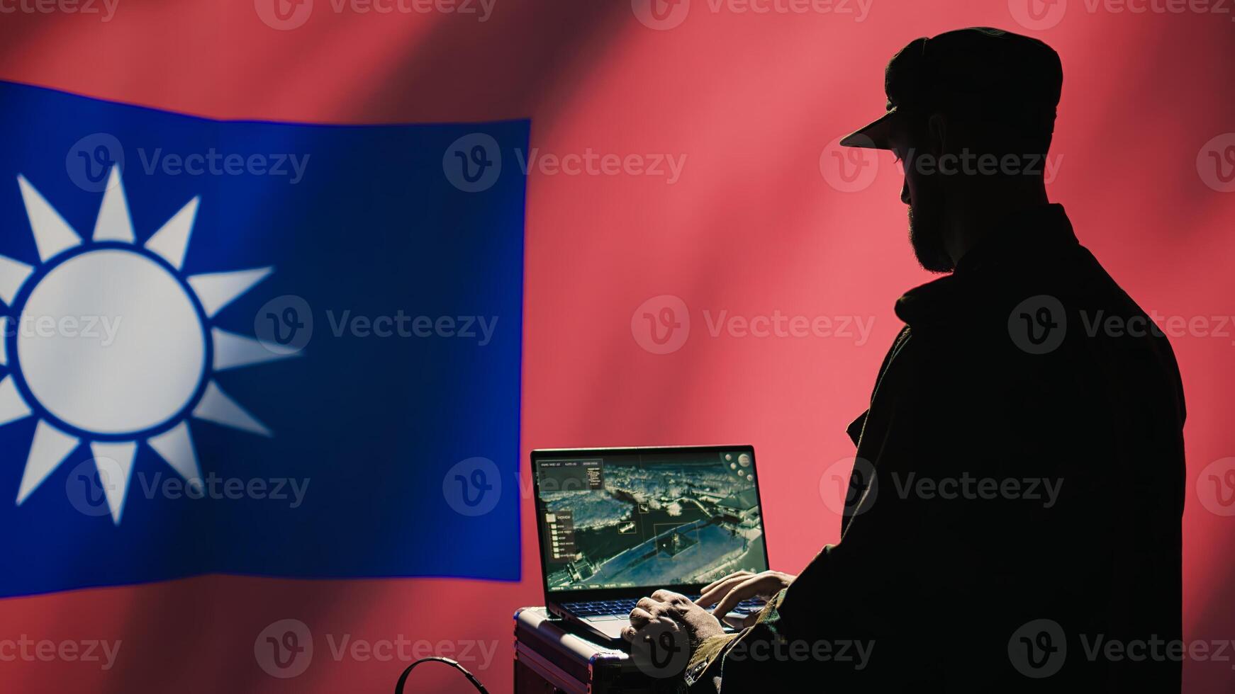 Communication systems operator working for Taiwanese freedom fighters uses radio and satellite equipment. Taiwan army unit manages broadcasting networks during territorial dispute with China, camera B photo