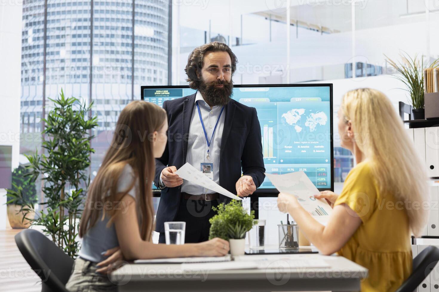 Parent and teenager in office doing brainstorming after listening investment strategy recommendations from financial advisor. Customers consulting after taking economic guidance from consultant photo