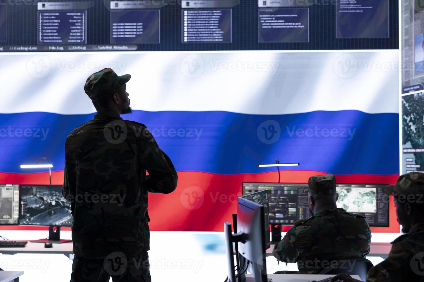 Military expert from Russian army working in governmental base of operations, breaking into rival states servers to spread fake news and hybrid warfare propaganda. Brainwashing population. photo