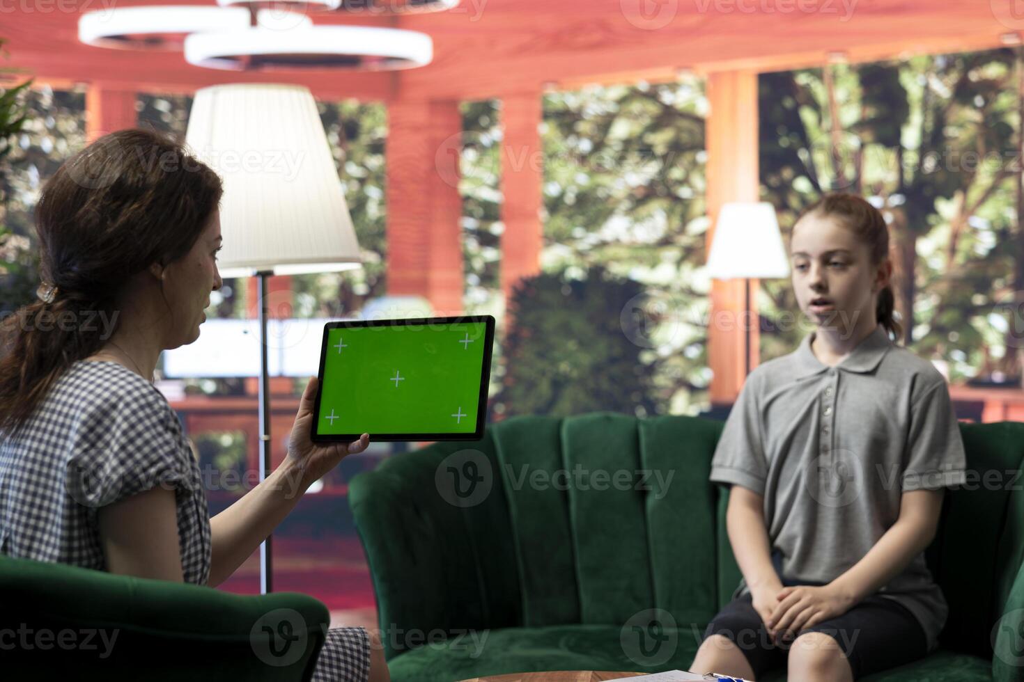 Teen girl in behavioral therapy next to copy space mockup discussing her struggles with depression and social anxiety. Teenager opening up about her mental health issues, counseling. photo