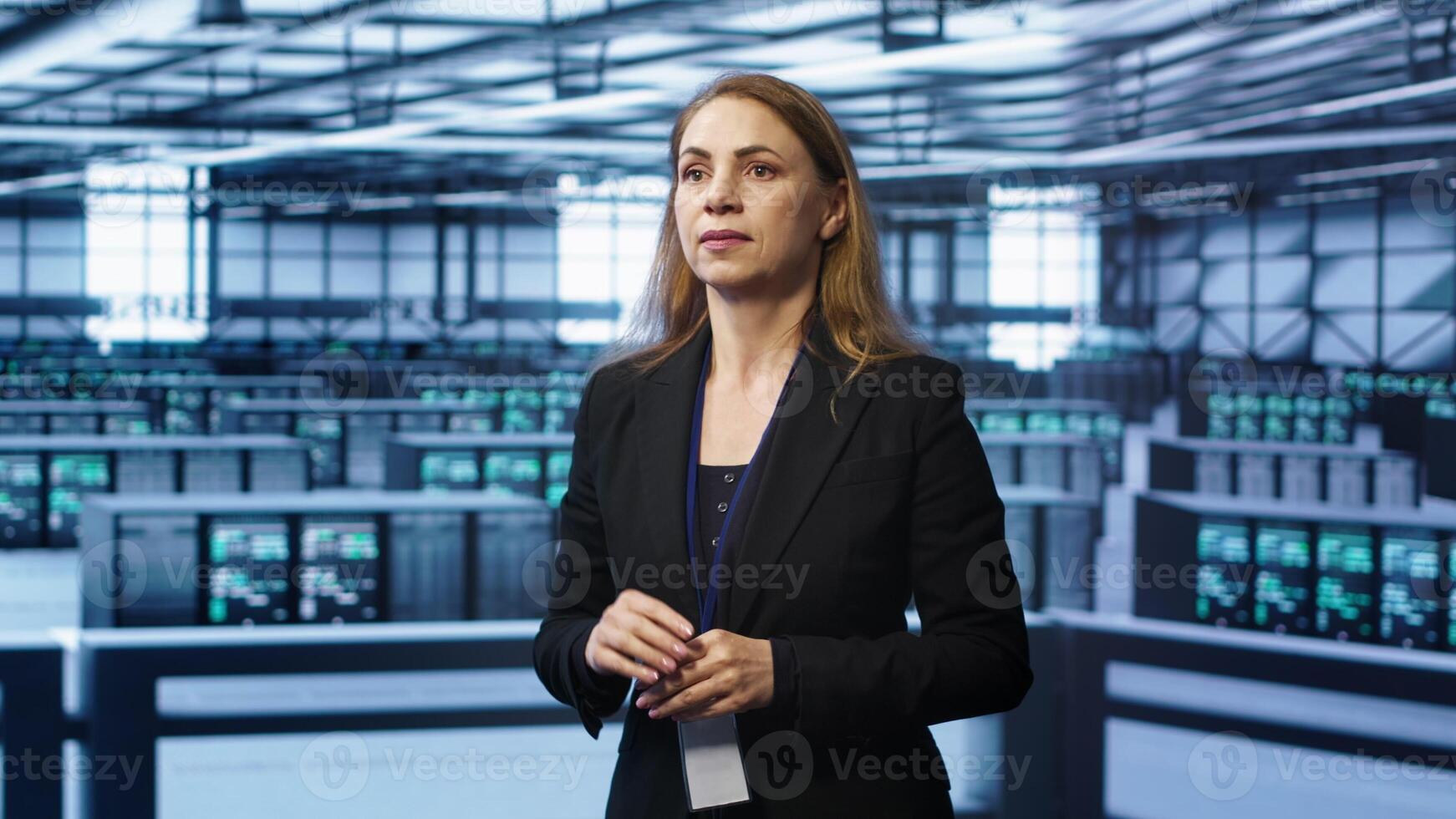 System administrator in high tech data center looking at hologram visualization. Computer scientist working on securing server terminals using AR tech, preventing hacker attacks, camera A photo
