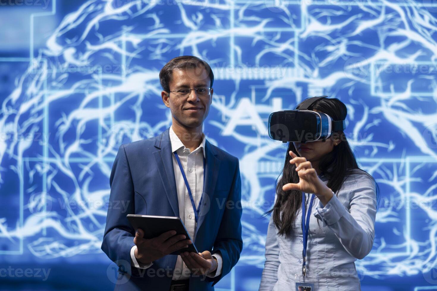 Researchers doing virtual reality demonstration at AI convention gathering tech startups and academics, showing how to use VR headset and artificial intelligence technology photo