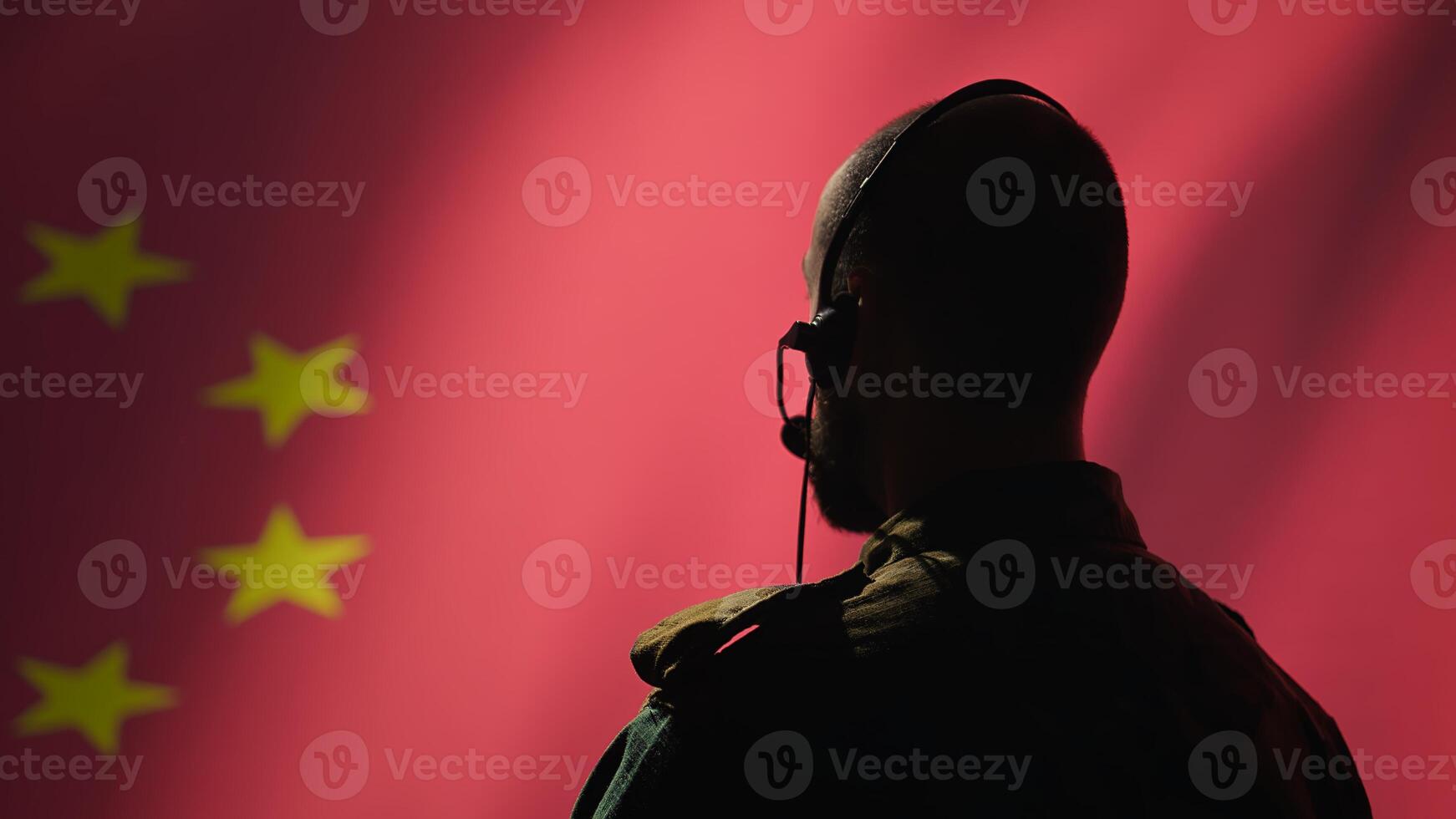 Military dispatcher working for Chinese Communist Party providing informations for troops using headset. Radio communications operator isolated over China flag background coordinating troops, camera B photo