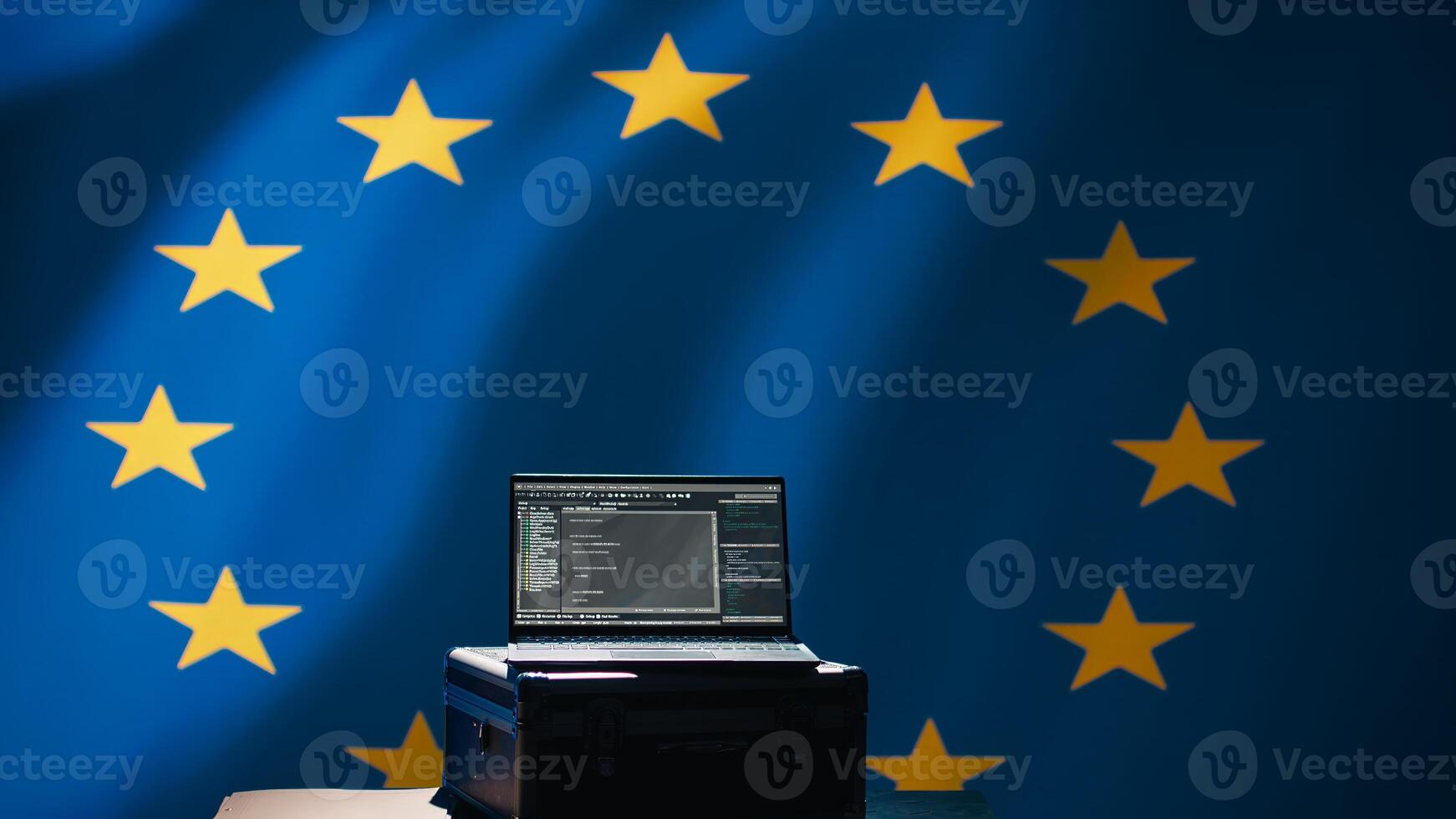 Laptop in European Union command center used by counterterrorism department to run security protocols against propaganda bots trying to destabilize democracy, isolated over EU flag, camera B photo