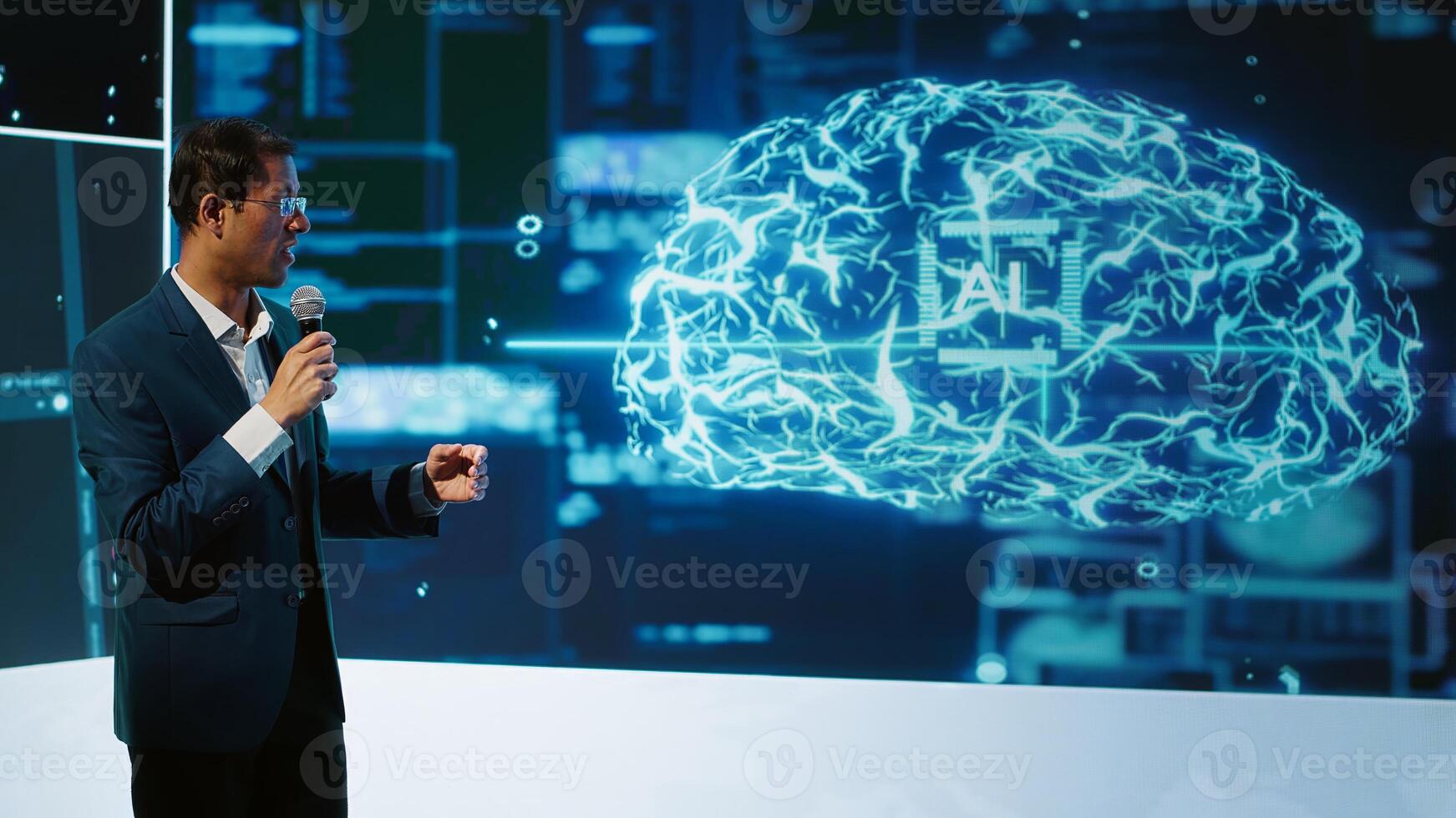 Tech company CEO using summit as platform to launch latest AI products. Manager uses mic to talk at forum to connect with business leaders and investors interested in artificial intelligence, camera A photo