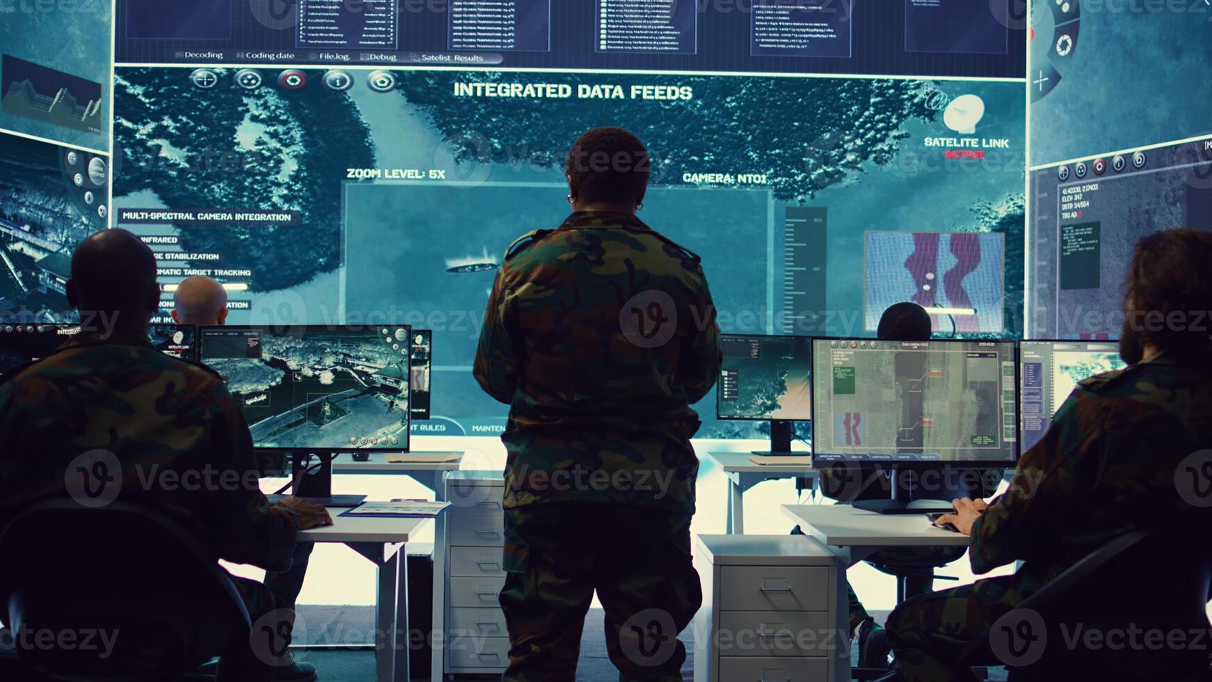 Woman colonel handling a special operation with big data in monitoring room, providing important satellite information to her crew in command post. Targeting enemy power base. Camera B. photo