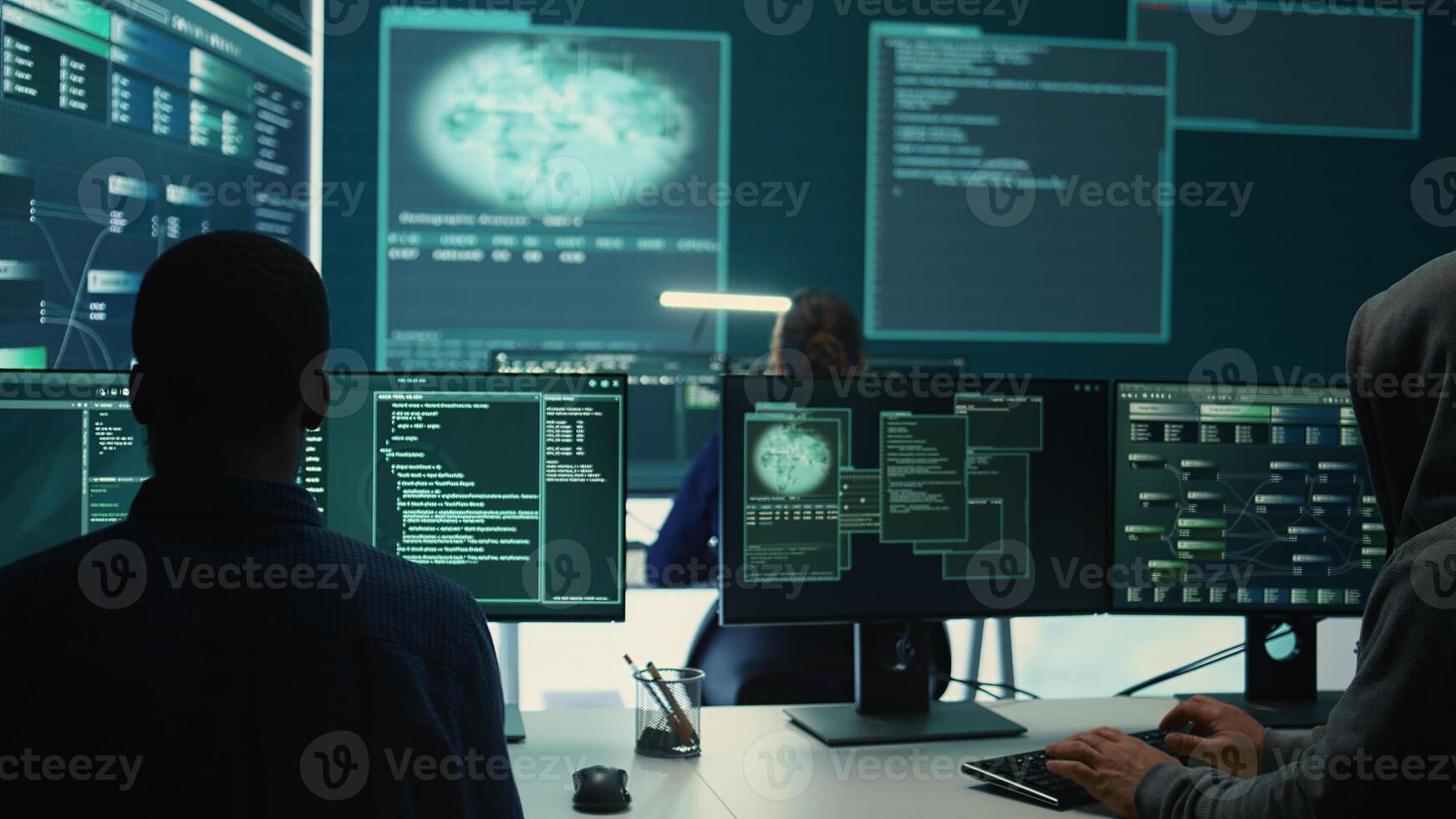 Governmental agency team conducting cyber security monitoring and threat detection tactics. IT experts work on cybercrime prevention, network security and information protection. Camera B. photo