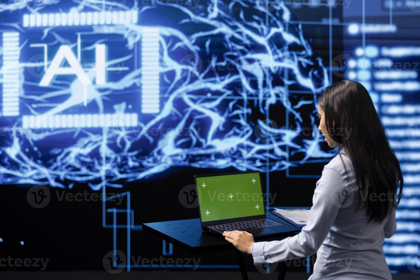 IT expert using green screen laptop and AI technology for business data analysis in high tech setting. Admin works on mockup notebook to automatize tasks using artificial intelligence photo