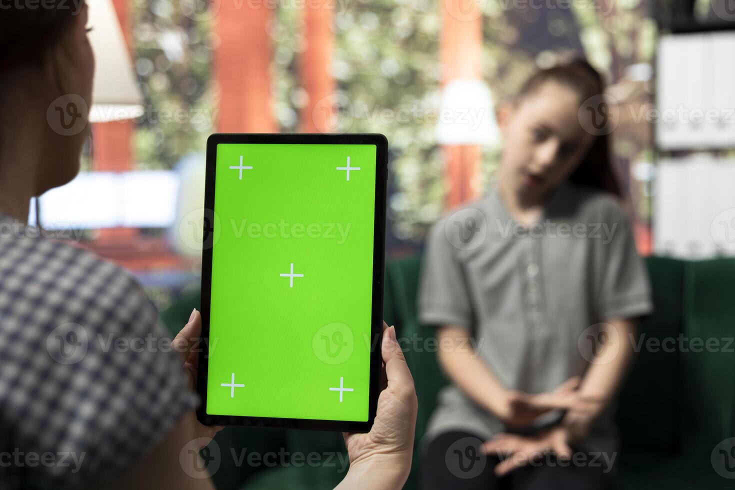 Teenager undergoing therapy for depression next to isolated chroma key screen, asking advice to boost self esteem. Psychologist expert guiding her to overcome her internal frustration. photo