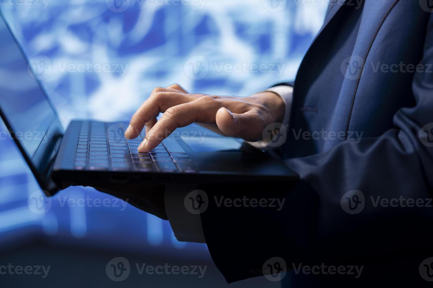 Data analyst using laptop to implement artificial intelligence parallel processing, breaking up complex computational tasks enabling AI systems to process more input data faster, close up shot photo