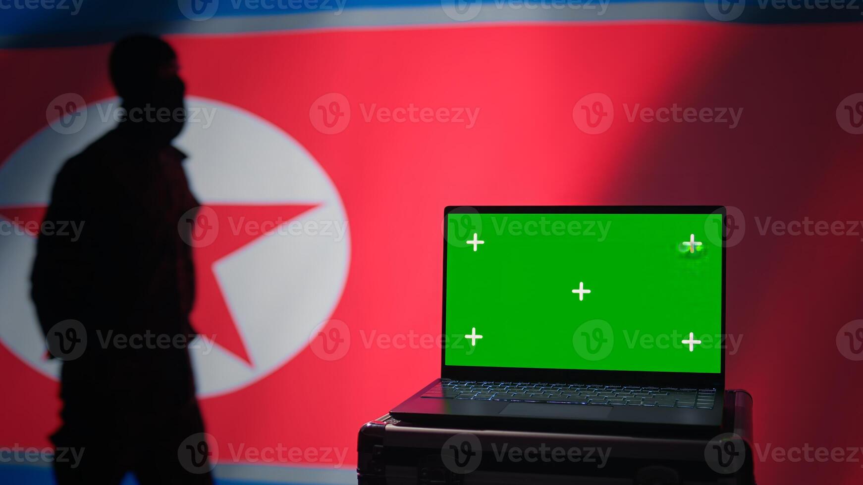 North Korea soldier using radar on green screen laptop to detect missiles during korean conflict. Pyongyang regime army soldier scanning rockets with chroma key notebook, close up shot, camera B photo