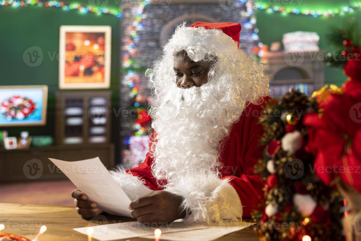 Santa Claus checking a letter while sitting in his rustic festive cabin, fulfilling wishes for children around the world. Saint Nicholas prepares gifts and toys for the winter holiday journey. photo