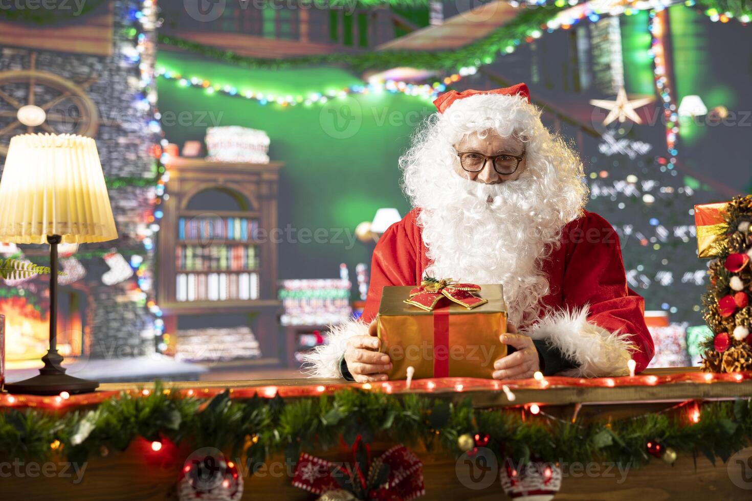 Saint Nicholas prepares a festive gift box by the fire. The North Pole workshop is alive with holiday decorations and the magic of giving, as Santa packs presents for children all over the world. photo