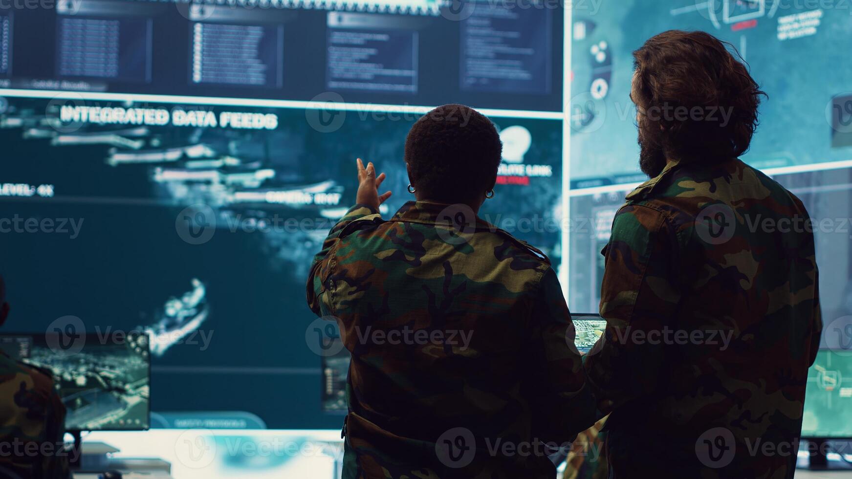 Military captains team monitoring world map via satellite CCTV footage, employing surveillance systems engaged in intelligence and information gathering to ensure mission success. Camera A. photo