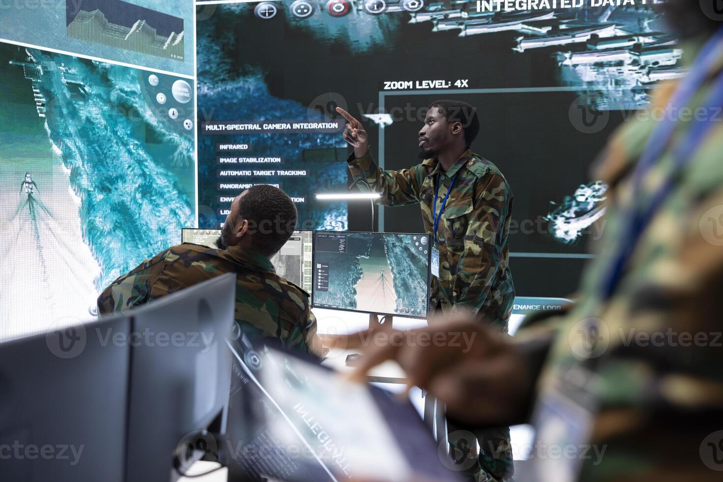Army intelligence specialists use high tech computer systems and satellite data to enhance national security, process and communicate important information. Helping troops with a field mission. photo