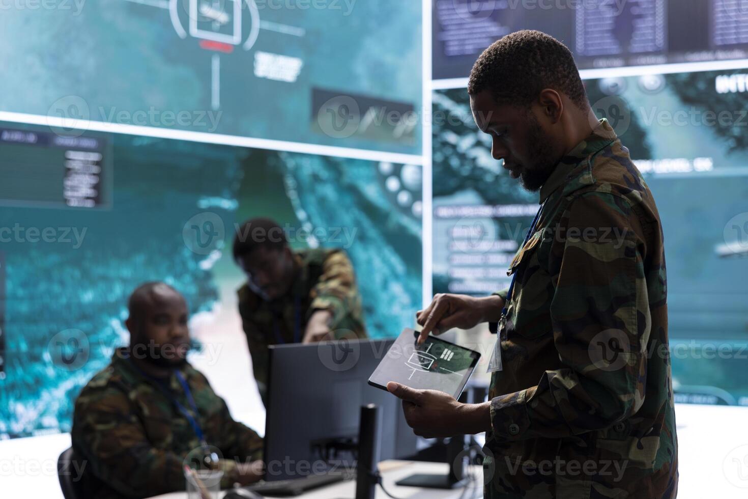 Group of soldiers in a secure office environment collaborates on intelligence analysis, and strategic planning. Showing crucial efforts for maintaining national security and operational efficiency. photo