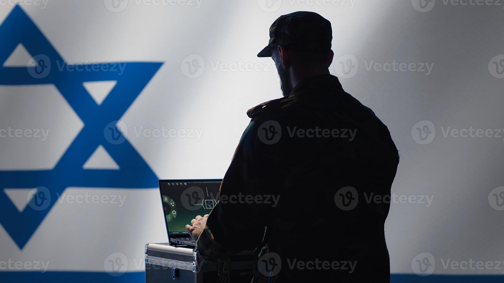 Israel Air Defense Forces early warning systems operator monitoring incoming enemy aerial attacks. IDF agent maintains air space superiority with radar during Middle East conflicts, camera A photo