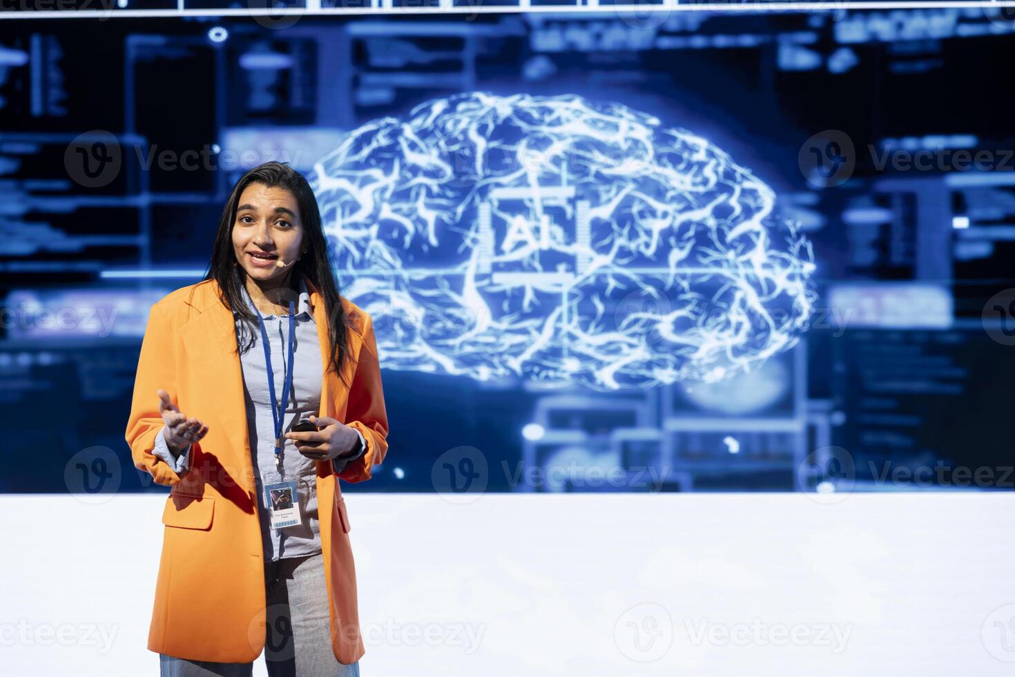IT professional holding presentation exploring ways emerging AI technologies can enhance businesses workforce. Computer scientist at event presents strategies for using artificial intelligence photo