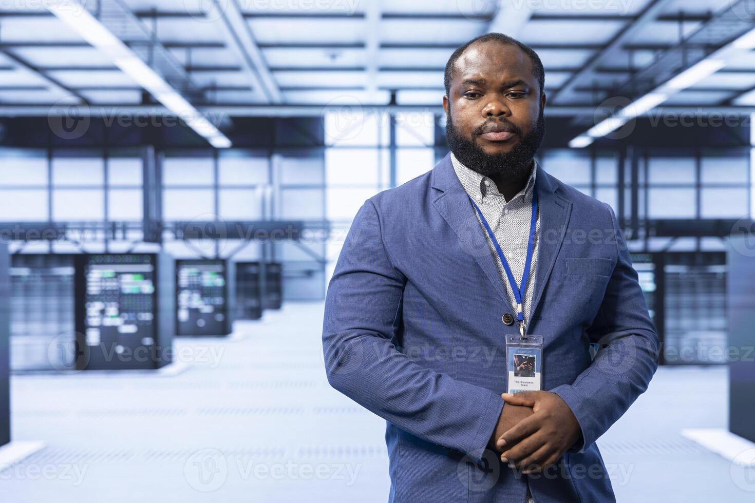Engineer in server room implementing and maintaining security measures to protect data and systems from unauthorized access or cyber threats. Data center employee doing hardware installation photo