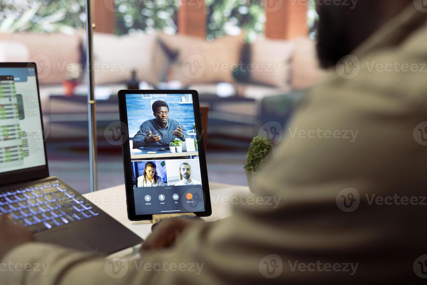 Businessman presents annual sales reports to the shareholders on videocall, working from home to increase funding. Entrepreneur making a development presentation for the investors. photo