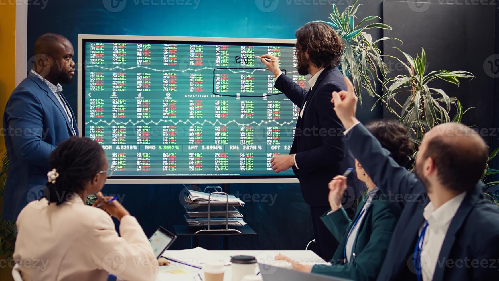 Sales management team reviewing global stock market trends in an informative meeting, extracting capital funds to start development projects. Business colleagues discuss enterprise growth. Camera B. photo
