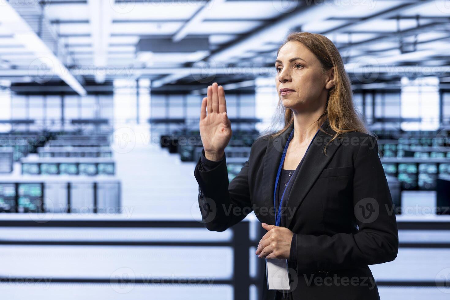 Engineer in server hub using AR technology checking hardware after installing storage units. Data center worker using augmented reality to do maintenance after replacing mainframes components photo