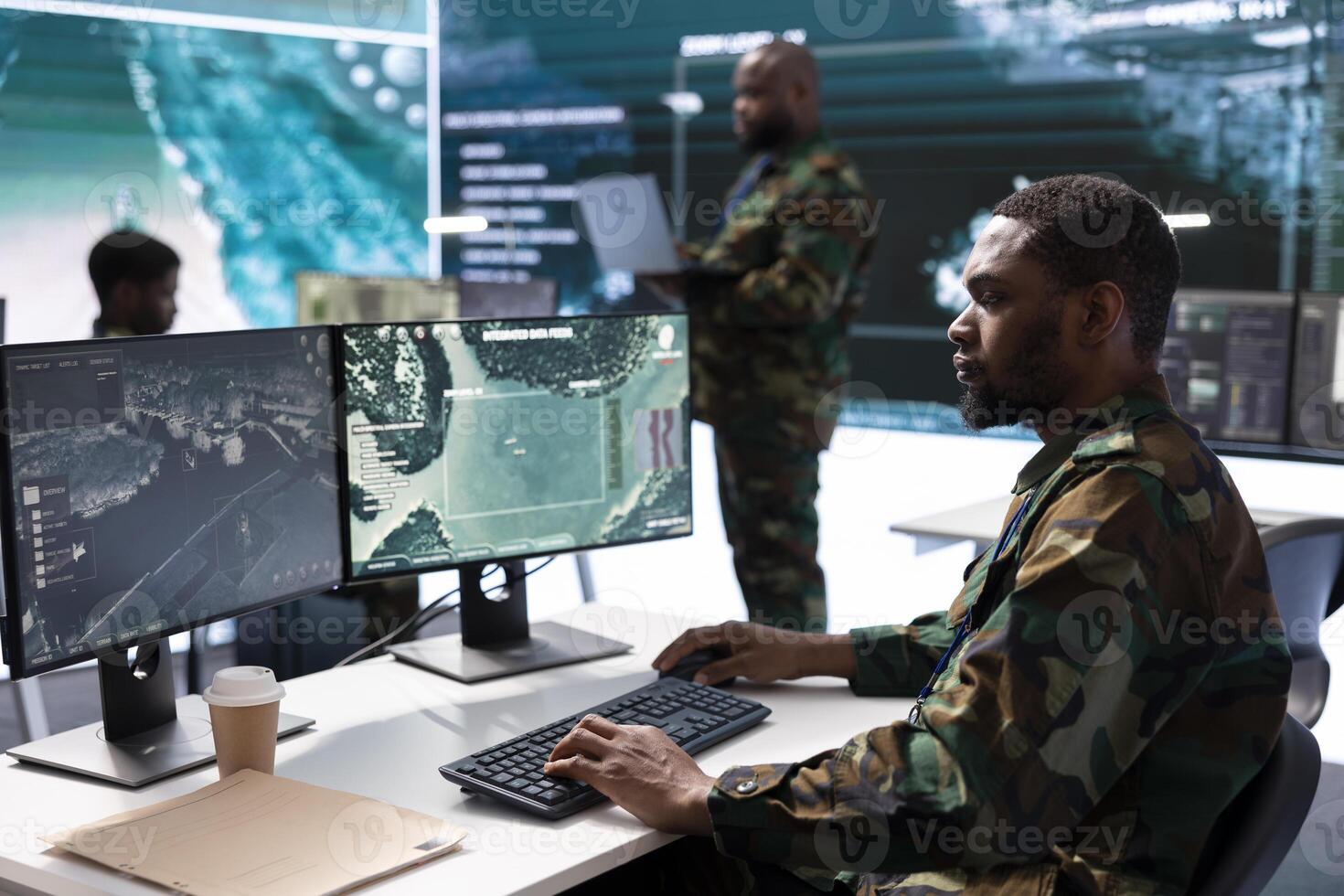 Military personnel in high tech command post work on data integration, processing real time surveillance. Maintaining security protocols to support strategic secret service operations. photo