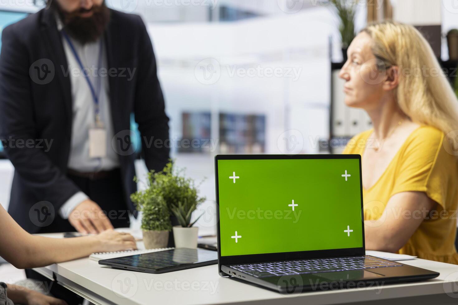Financial adviser doing presentation on isolated screen laptop to help clients build saving habits, close up. Agent using chroma key notebook to show customers investing tips photo