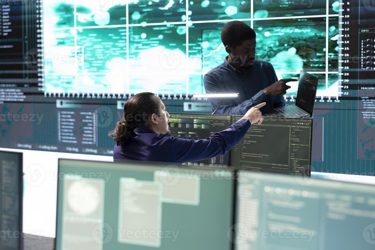 Cyber security team conducting cyber surveillance and threat detection in a governmental agency. Hackers working on cybercrime and malware prevention, data breach protection. photo