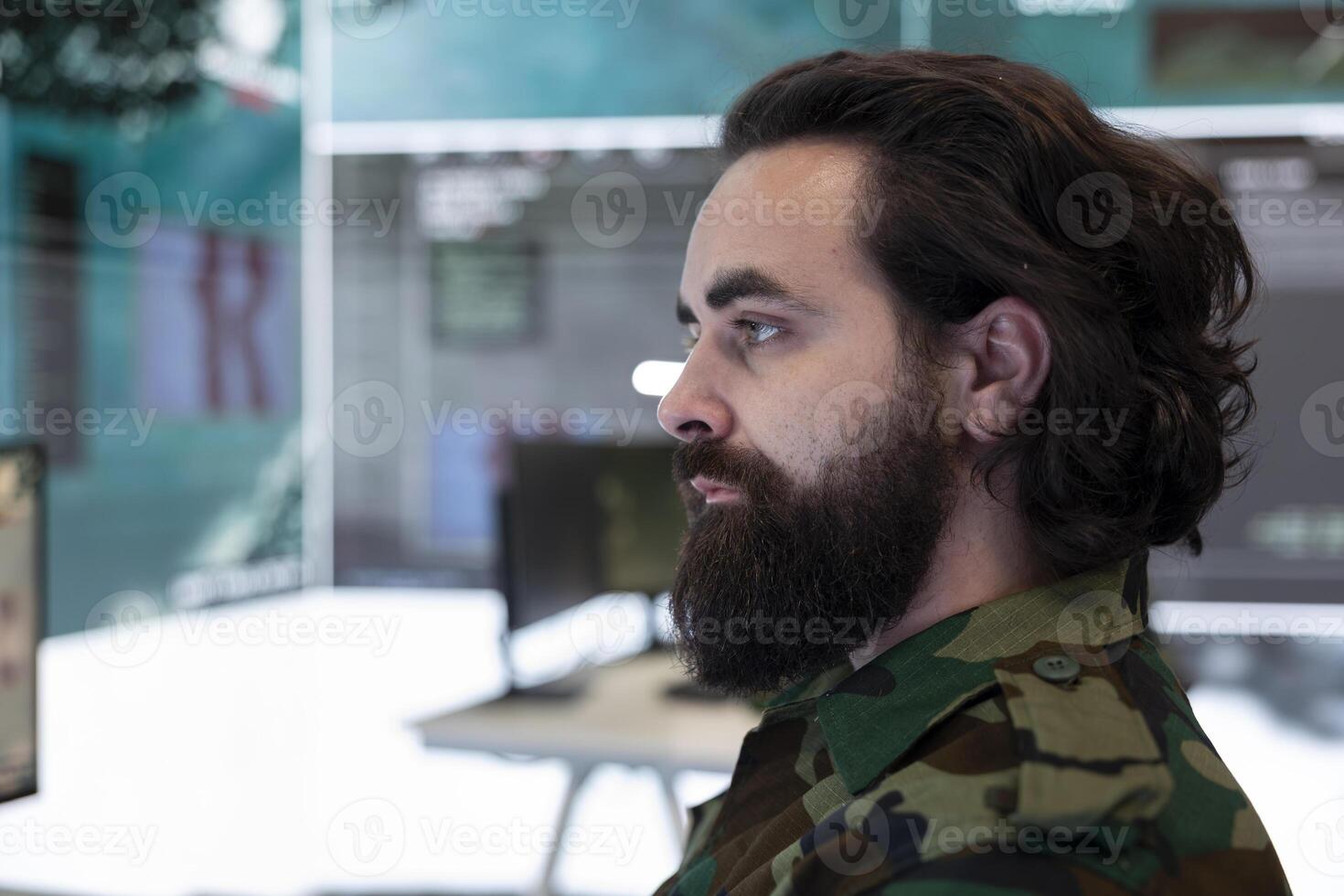 Major army officer studying surveillance satellite system on a world map to detect enemy through gps tracking in operation room. Anti terrorism secret service department. Close up. photo