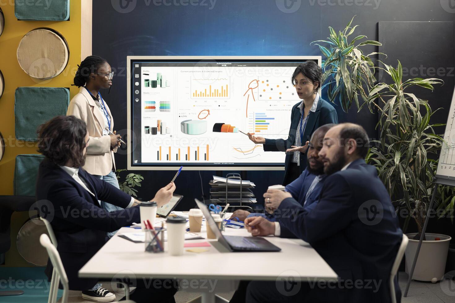 Team members from a financial organization showing insight on new projects during an executive meeting. Team of colleagues discussing the agenda for upcoming events in the industry. photo