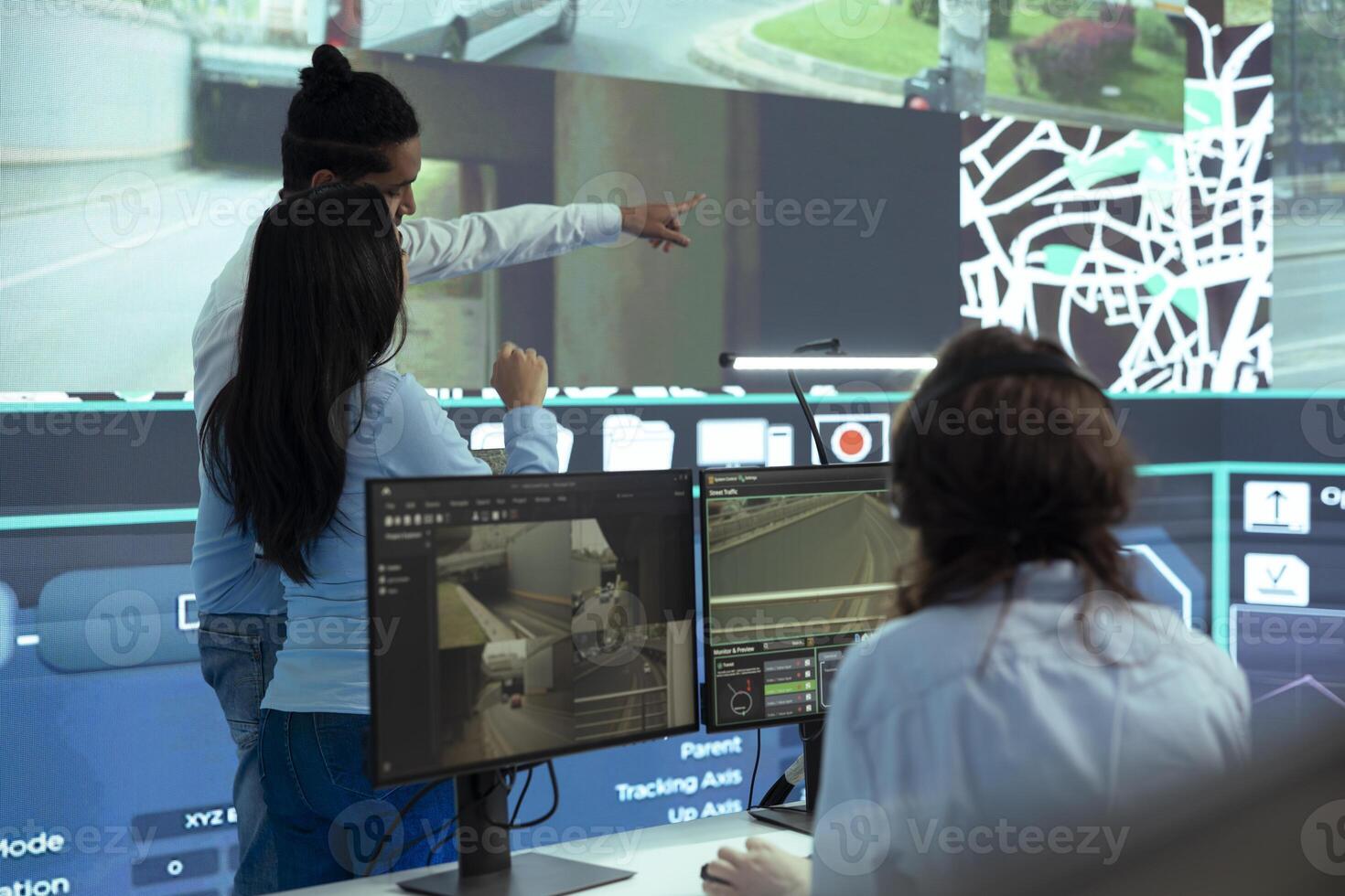 Indian team of managers coordinating their staff to locate and follow delivery trucks with cargo, ensuring easy shipping at destination. Employees navigating on satellite map with radar gps. photo