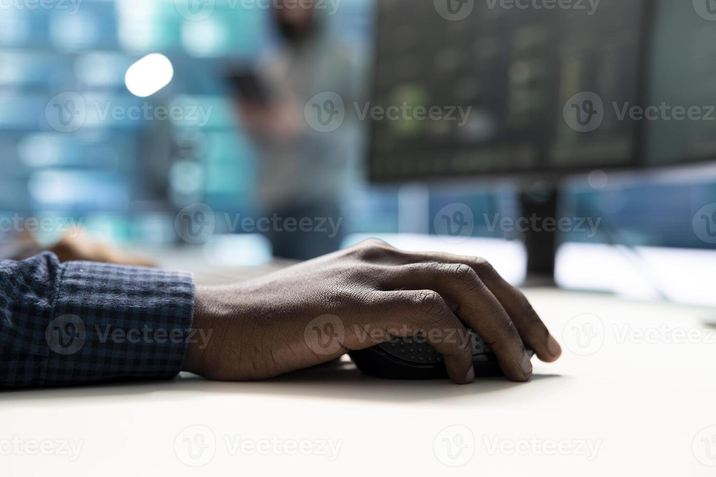 Governmental hackers at work monitoring cyber threats in high tech agency, implementing cybersecurity measures. IT expert focuses the importance of online privacy and malware protection. photo